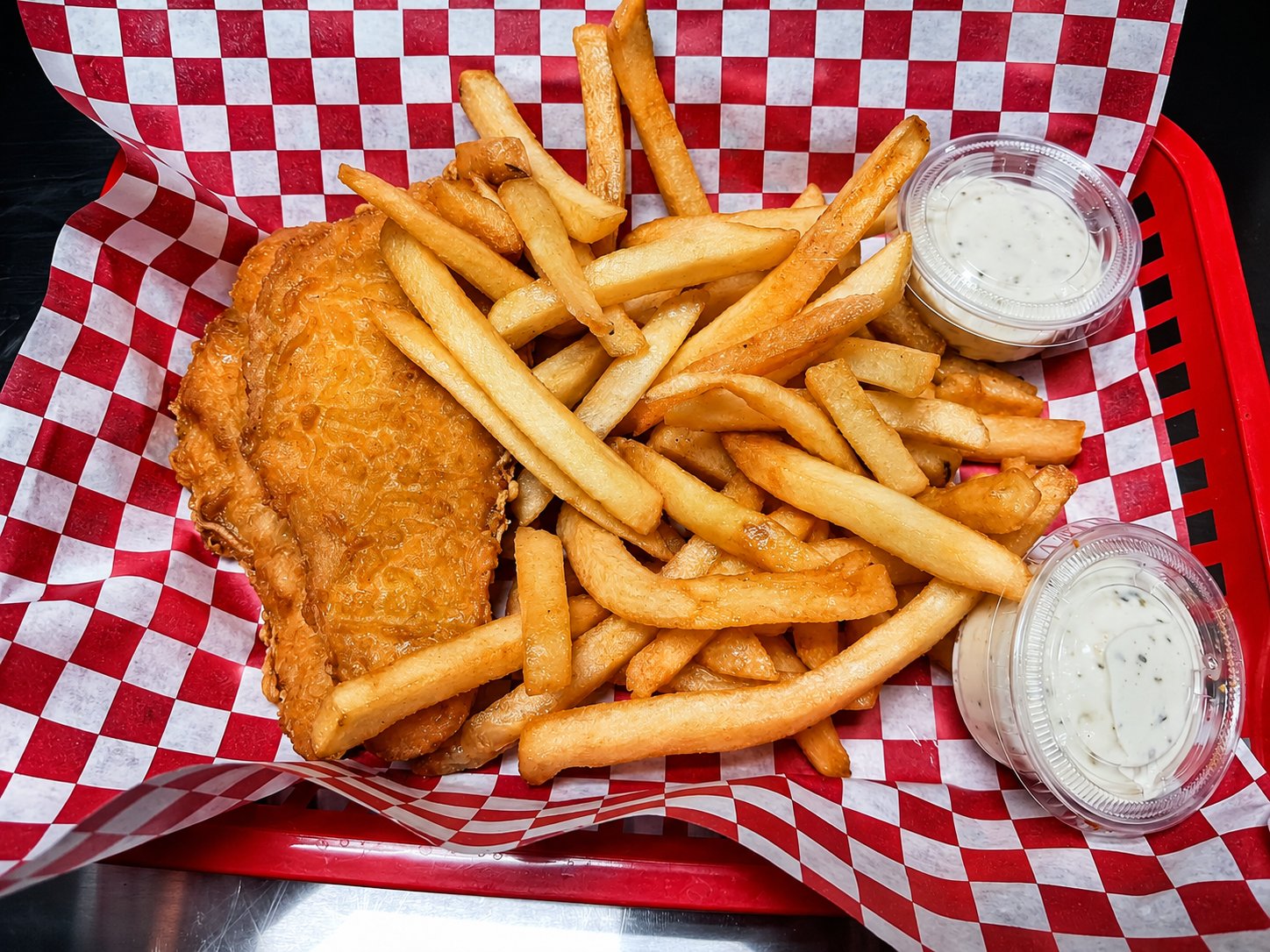 Beer-battered fish and chips with tartar sauce