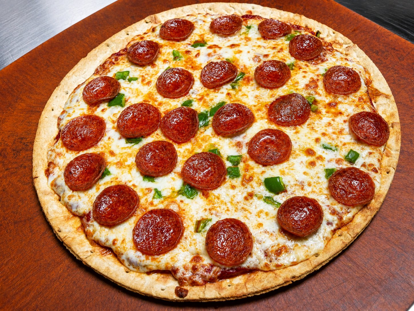 Pepperoni and jalapeño pizza fresh out of the oven