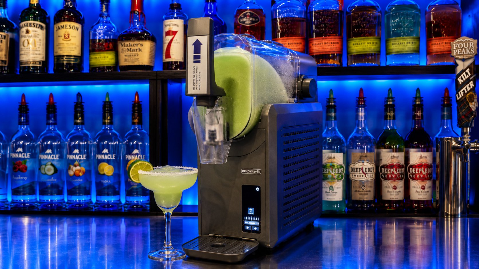The slushie machine pouring a fresh margarita
